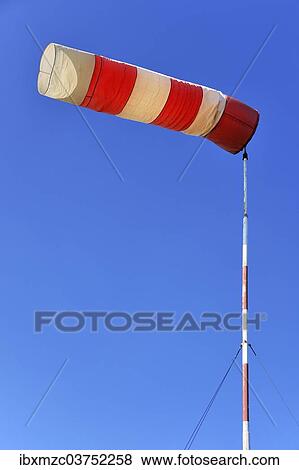 "Red and white windsock against a blue sky, Lilling, Middle Franconia, Bavaria, Germany, Europe" View Large Photo Image Stock Photo - "Red and white windsock against a blue sky, Lilling, Middle Franconia, Bavaria, Germany, Europe". Fotosearch