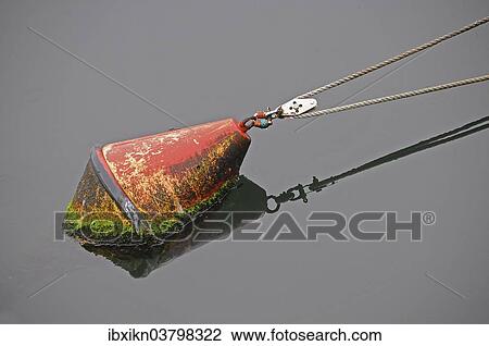 Stock Image - "Red buoy, harbour, Warnemunde, Mecklenburg-Western Pomerania, Germany, Europe". Fotosearch
