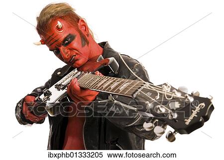 Red Devil pointing an electric guitar at the viewer View Large Photo Image Stock Photography - Red Devil pointing an electric guitar at the viewer. Fotosearch