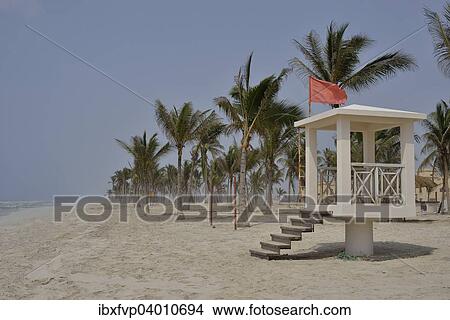 "Red flag, bathing is prohibited, on Salalah Beach, Salalah, Dhofar Region, Oman, Asia" View Large Photo Image Picture - "Red flag, bathing is prohibited, on Salalah Beach, Salalah, Dhofar Region, Oman, Asia". Fotosearch