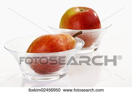 "Red fruit, apple and pear in glass bowls" View Large Photo Image Stock Image - "Red fruit, apple and pear in glass bowls". Fotosearch