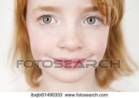 Stock Image - "Red-haired girl, portrait". Fotosearch