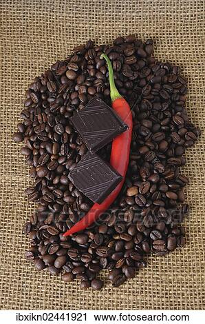 Red pepper and chocolate on coffee beans View Large Photo Image Stock Image - Red pepper and chocolate on coffee beans. Fotosearch