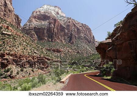 Stock Photo - "Red Road in the mountains of Zion National Park, Utah, USA". Fotosearch