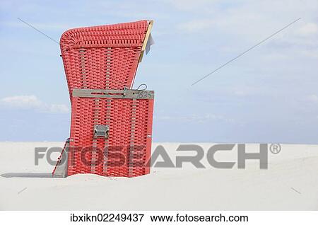 "Red roofed wicker beach chair, beach on the North Sea, St. Peter-Ording, Schleswig-Holstein, Germany, Europe" View Large Photo Image Stock Photo - "Red roofed wicker beach chair, beach on the North Sea, St. Peter-Ording, Schleswig-Holstein, Germany, Europe". Fotosearch