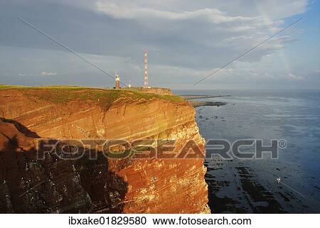 "Red sandstone cliffs of Heligoland in the evening light with a rainbow, Oberland, Heligoland, North Sea, Schleswig-Holstein, Germany, Europe" View Large Photo Image Stock Image - "Red sandstone cliffs of Heligoland in the evening light with a rainbow, Oberland, Heligoland, North Sea, Schleswig-Holstein, Germany, Europe". Fotosearch