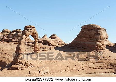 Stock Image - "Red sandstone, Delicate Arch, natural stone arches and rock formations, Arches National Park, Utah, Western United States, United States of America, North America". Fotosearch