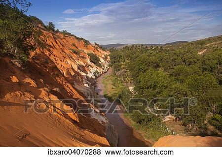 Stock Photo - "Red sandstone formations of the canyon on Fairy Stream, Mui Ne, Vietnam, Asia". Fotosearch