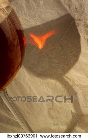 Red wine glass with reflection on tissue paper View Large Photo Image Stock Image - Red wine glass with reflection on tissue paper. Fotosearch