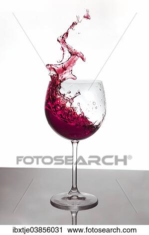 Red wine splashing out of a red wine glass View Large Photo Image Stock Image - Red wine splashing out of a red wine glass. Fotosearch