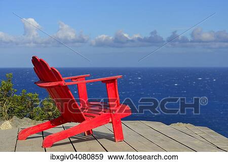 "Red wooden chair on a terrace overlooking the Mediterranean Sea, Licciola in L'Ile-Rousse, Haute Corse, Corsica, France, Europe" View Large Photo Image Stock Photo - "Red wooden chair on a terrace overlooking the Mediterranean Sea, Licciola in L'Ile-Rousse, Haute Corse, Corsica, France, Europe". Fotosearch
