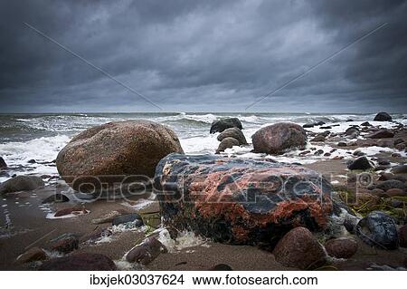 "Reddish coloured boulders on the beach, a rough Baltic Sea at back, Rerik, Mecklenburg-Western Pomerania, Germany, Europe" View Large Photo Image Picture - "Reddish coloured boulders on the beach, a rough Baltic Sea at back, Rerik, Mecklenburg-Western Pomerania, Germany, Europe". Fotosearch