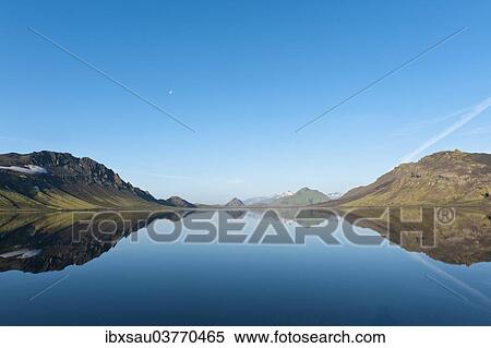 "Reflection in the still lake, panoramic mountain landscape at Alftavatn lake, Laugavegur trekking route, Highlands, Suourland, Iceland, Europe" View Large Photo Image Stock Photography - "Reflection in the still lake, panoramic mountain landscape at Alftavatn lake, Laugavegur trekking route, Highlands, Suourland, Iceland, Europe". Fotosearch
