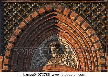Stock Photograph - "Relief of Christ above the side entrance of the neo-Gothic St. Paul's Church, built 1863-1869, Schwerin, Mecklenburg-Western Pomerania, Germany, Europe". Fotosearch