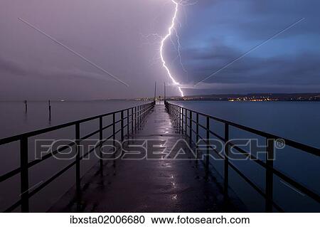 "Retreating thunderstorm, left, and magic hour with lightning, right, jetty of Konstanz Therme, Lake Constance, Baden-Wuerttemberg, Germany, Europe, PublicGround, Europe" View Large Photo Image Stock Image - "Retreating thunderstorm, left, and magic hour with lightning, right, jetty of Konstanz Therme, Lake Constance, Baden-Wuerttemberg, Germany, Europe, PublicGround, Europe". Fotosearch