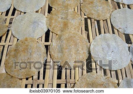 "Rice cakes drying on a bamboo frame, Bali, Indonesia, Asia" View Large Photo Image Stock Photography - "Rice cakes drying on a bamboo frame, Bali, Indonesia, Asia". Fotosearch