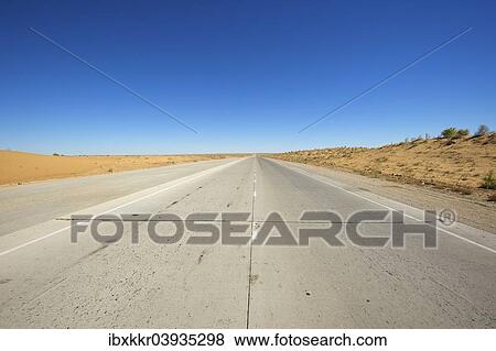 Stock Photo - "Road in the Kyzyl Kum desert, Uzbekistan, Asia". Fotosearch