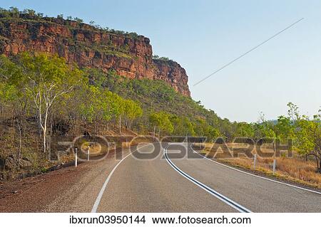 "Road, red cliffs, Northern Territory, Australia, Oceania" View Large Photo Image Picture - "Road, red cliffs, Northern Territory, Australia, Oceania". Fotosearch