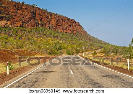 "Road, red cliffs, Northern Territory, Australia, Oceania" View Large Photo Image Stock Photography - "Road, red cliffs, Northern Territory, Australia, Oceania". Fotosearch