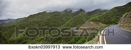 Stock Image - "Road winding from the forest to the valley of Vallehermoso, La Gomera, Canary Islands, Spain, Europe". Fotosearch