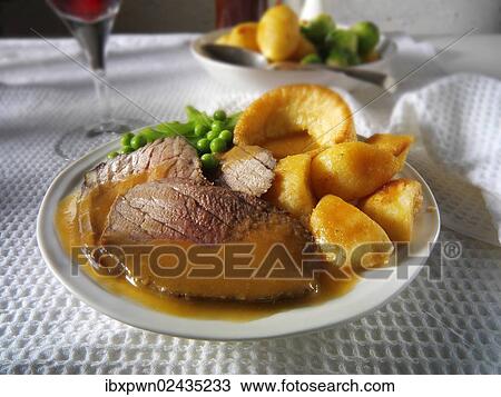 Roast beef with Yorkshire pudding and gravy View Large Photo Image Stock Image - Roast beef with Yorkshire pudding and gravy. Fotosearch
