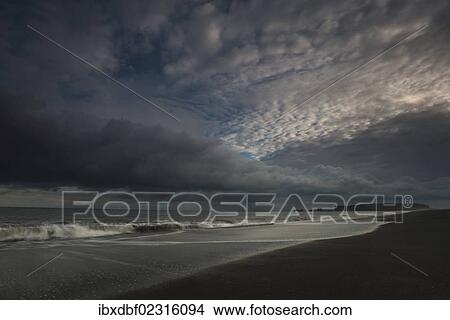 "Rock arch, Dyrholaey peninsula, black sandy beach near Vik i Myrdal, southern coast, Iceland, Europe" View Large Photo Image Picture - "Rock arch, Dyrholaey peninsula, black sandy beach near Vik i Myrdal, southern coast, Iceland, Europe". Fotosearch