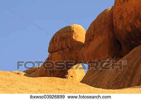 "Rock formation The Bridge in evening light, rock arch, natural arch, Pontok Mountains, Great Spitzkoppe Nature Reserve, Namibia, Africa" View Large Photo Image Stock Photo - "Rock formation The Bridge in evening light, rock arch, natural arch, Pontok Mountains, Great Spitzkoppe Nature Reserve, Namibia, Africa". Fotosearch