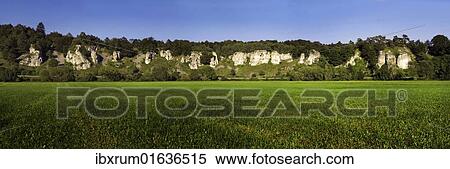Stock Photography - "Rock formation twelve apostles with a green meadow, Altmuehltal nature park, near Solhofen, Bavaria, Germany, Europe". Fotosearch