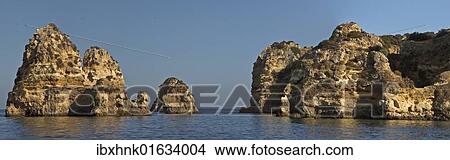 Picture - "Rock formations in the sea at Lagos, Portugal, Europe". Fotosearch
