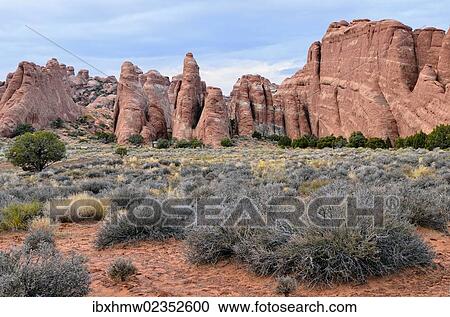 Stock Image - "Rock formations of red sandstone near the Devils Garden Trailhead, Arches National Park, Moab, Utah, USA". Fotosearch