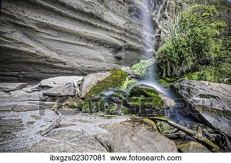 "Rock formations of Truman's Cove at the beach with a waterfall, Te Miko, Truman's Bay, Paparoa National Park, Punakaiki, South Island, New Zealand, Oceania" View Large Photo Image Stock Image - "Rock formations of Truman's Cove at the beach with a waterfall, Te Miko, Truman's Bay, Paparoa National Park, Punakaiki, South Island, New Zealand, Oceania". Fotosearch