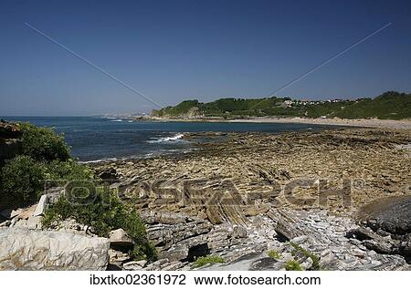 Stock Image - "Rock formations on the rocky coast, Atlantic coast near Saint-Jean-de-Luz, Donibane Lohizune in Basque, Aquitaine region, department of Pyrenees-Atlantiques, France, Europe". Fotosearch