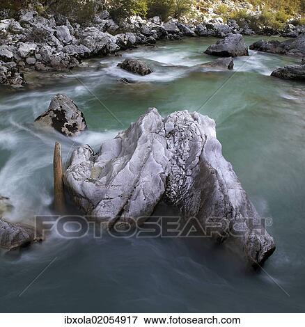 "Rock in the turquoise Soca river, Soca Valley near Bovec, Triglav National Park, Slovenia, Europe" View Large Photo Image Stock Photo - "Rock in the turquoise Soca river, Soca Valley near Bovec, Triglav National Park, Slovenia, Europe". Fotosearch