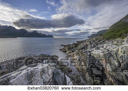 "Rock structures on the coast near Husoy, Senja Island, Troms, Norway, Europe" View Large Photo Image Stock Image - "Rock structures on the coast near Husoy, Senja Island, Troms, Norway, Europe". Fotosearch