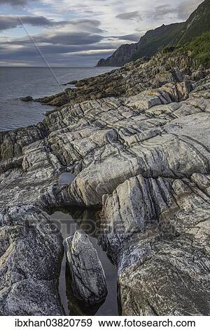 "Rock structures on the coast near Husoy, Senja Island, Troms, Norway, Europe" View Large Photo Image Stock Photo - "Rock structures on the coast near Husoy, Senja Island, Troms, Norway, Europe". Fotosearch