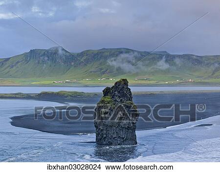 Picture - "Rock tower in Reynir Bay, Dyrholaey, Vik i Myrdal, Southern Region, Iceland, Europe". Fotosearch
