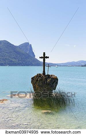 Stock Photography - "Rock with a cross, Mondsee Lake, Salzkammergut, Salzburg State, Upper Austria, Austria, Europe". Fotosearch