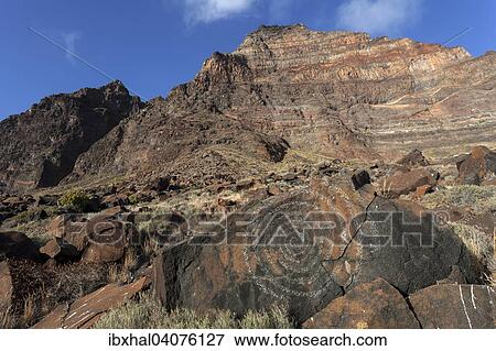 "Rock with spiral drawing in front of Risca de la Merica, La Playa Calera, Valle Gran Rey, Canary Islands, Spain, Europe" View Large Photo Image Stock Photo - "Rock with spiral drawing in front of Risca de la Merica, La Playa Calera, Valle Gran Rey, Canary Islands, Spain, Europe". Fotosearch