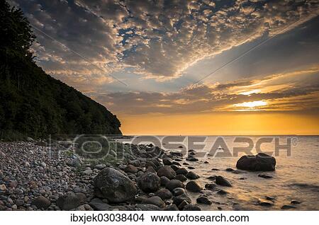 "Rocks on a beach at sunset by the sea, bei Nardewitz, Rugen island, Rugen, Mecklenburg-Western Pomerania, Germany, Europe" View Large Photo Image Picture - "Rocks on a beach at sunset by the sea, bei Nardewitz, Rugen island, Rugen, Mecklenburg-Western Pomerania, Germany, Europe". Fotosearch