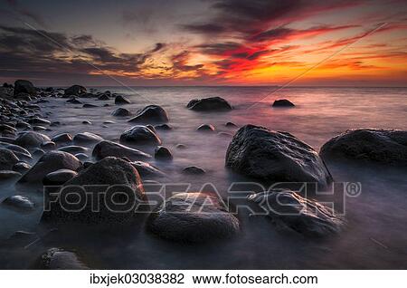 "Rocks on a beach at sunset by the sea, bei Nardewitz, Rugen island, Rugen, Mecklenburg-Western Pomerania, Germany, Europe" View Large Photo Image Stock Image - "Rocks on a beach at sunset by the sea, bei Nardewitz, Rugen island, Rugen, Mecklenburg-Western Pomerania, Germany, Europe". Fotosearch