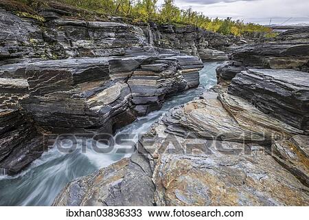 Stock Image - "Rocks on the Abiskojakka river, Abisko National Park, Norrbotten County, Sweden, Europe". Fotosearch