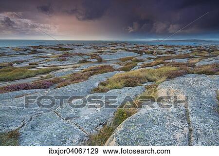 "Rocks, sunset, stormy atmosphere, coastline near Smogen, Bohuslan province, Vastra Gotaland County, Sweden, Europe" View Large Photo Image Stock Photo - "Rocks, sunset, stormy atmosphere, coastline near Smogen, Bohuslan province, Vastra Gotaland County, Sweden, Europe". Fotosearch