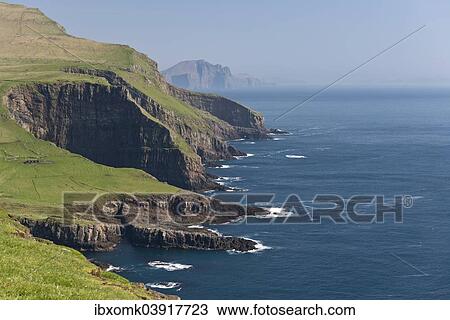 "Rocky coast of Mykines, Vagar behind, Mykines, Utoyggjar, Faroe Islands, Denmark, Europe" View Large Photo Image Stock Image - "Rocky coast of Mykines, Vagar behind, Mykines, Utoyggjar, Faroe Islands, Denmark, Europe". Fotosearch
