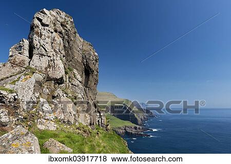 "Rocky coast of Mykines, Vagar behind, Mykines, Utoyggjar, Faroe Islands, Denmark, Europe" View Large Photo Image Stock Photo - "Rocky coast of Mykines, Vagar behind, Mykines, Utoyggjar, Faroe Islands, Denmark, Europe". Fotosearch