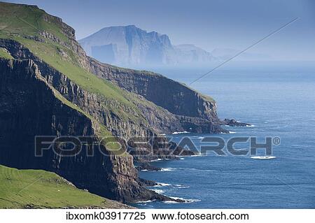 "Rocky coast of Mykines, Vagar behind, Mykines, Utoyggjar, Faroe Islands, Denmark, Europe" View Large Photo Image Stock Photography - "Rocky coast of Mykines, Vagar behind, Mykines, Utoyggjar, Faroe Islands, Denmark, Europe". Fotosearch