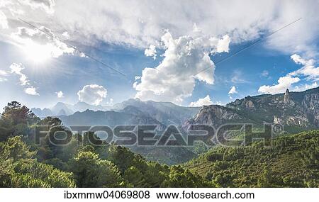 "Rocky landscape with pines and cloudy sky, Bavella, Bavella Massif, Corsica, France, Europe" View Large Photo Image Stock Photo - "Rocky landscape with pines and cloudy sky, Bavella, Bavella Massif, Corsica, France, Europe". Fotosearch