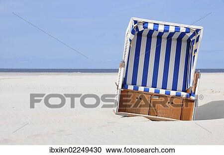 "Roofed wicker beach chair, beach on the North Sea, St. Peter-Ording, Schleswig-Holstein, Germany, Europe" View Large Photo Image Stock Image - "Roofed wicker beach chair, beach on the North Sea, St. Peter-Ording, Schleswig-Holstein, Germany, Europe". Fotosearch