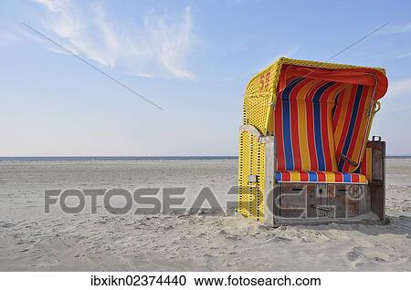 "Roofed wicker beach chair, North Sea, Amrum, Schleswig-Holstein, Germany, Europe" View Large Photo Image Stock Image - "Roofed wicker beach chair, North Sea, Amrum, Schleswig-Holstein, Germany, Europe". Fotosearch