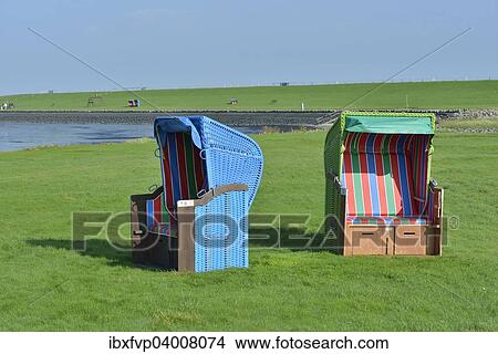 "Roofed wicker beach chairs at the Horn swimming spot, Pellworm, North Frisia, Schleswig-Holstein, Germany, Europe" View Large Photo Image Picture - "Roofed wicker beach chairs at the Horn swimming spot, Pellworm, North Frisia, Schleswig-Holstein, Germany, Europe". Fotosearch