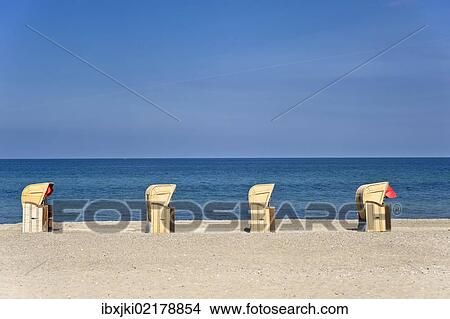 "Roofed wicker beach chairs standing on the beach, Dahme, Baltic Sea, Schleswig-Holstein, Germany, Europe" View Large Photo Image Picture - "Roofed wicker beach chairs standing on the beach, Dahme, Baltic Sea, Schleswig-Holstein, Germany, Europe". Fotosearch